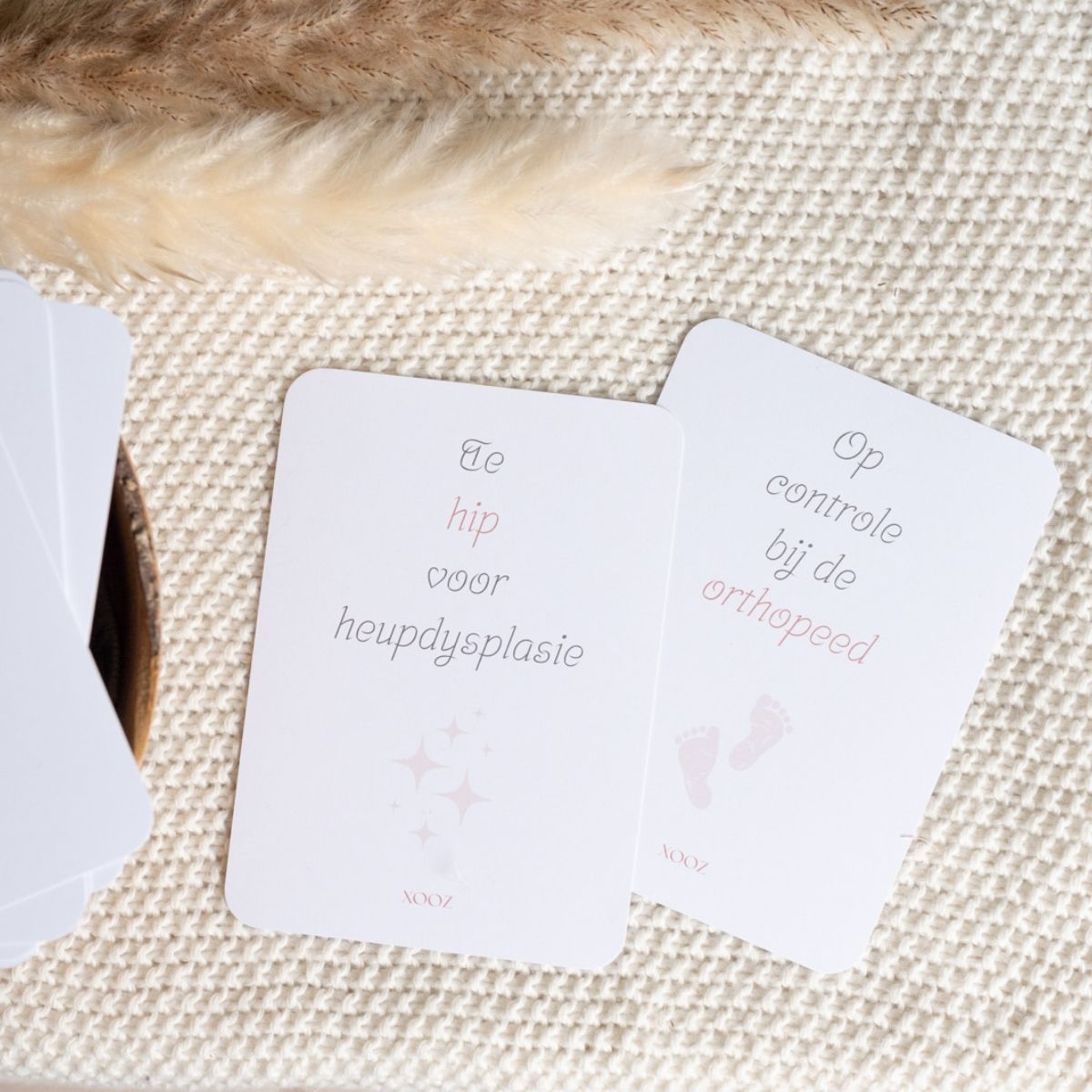 set mijlpaalkaarten voor ouders van baby’s en peuters met een gips- of spreidbroek